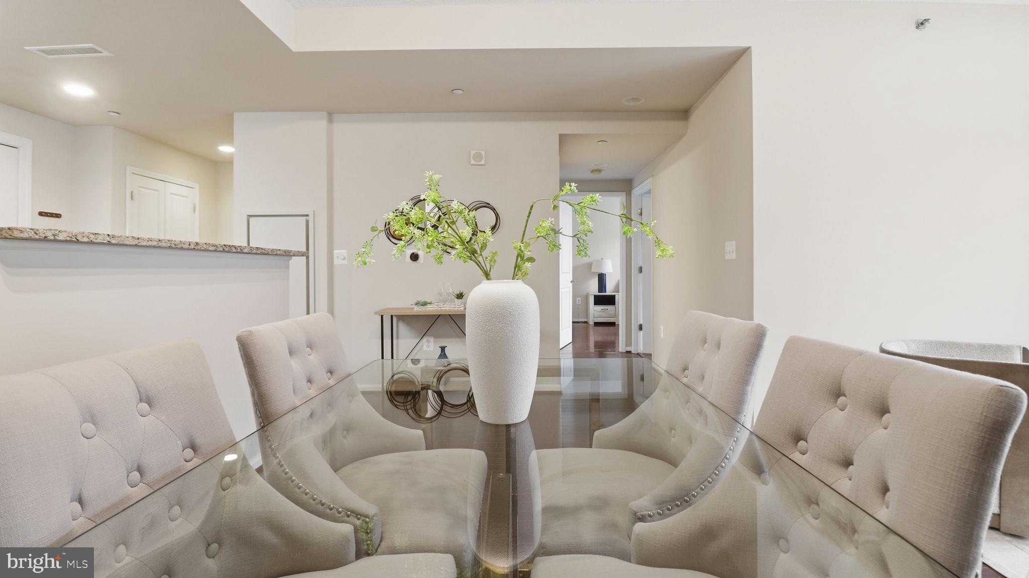 11700 Old Georgetown Road, Unit 1007 North Bethesda, MD 20852 - Photo 9 of 36 Elegant dining space with modern flair.