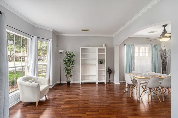 a kitchen with stainless steel appliances kitchen island granite countertop a refrigerator a sink and a stove