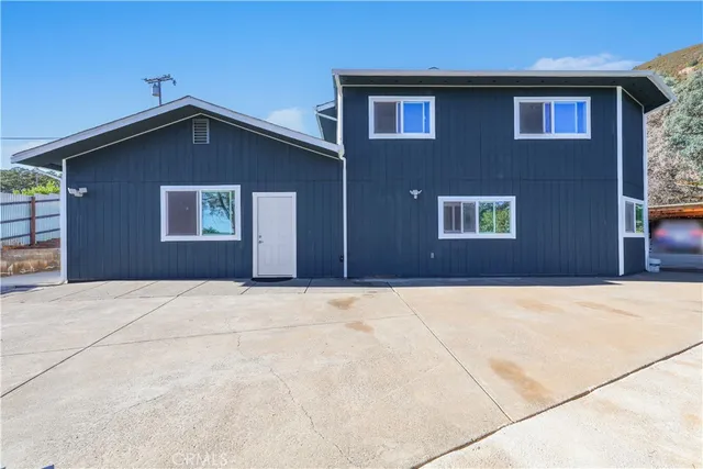 a house with yard in front of it