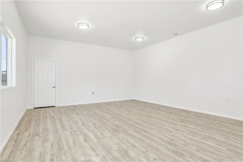 3273 Lee Street Nice, CA 95464 - Photo 20 of 50 a view of an empty room with wooden floor