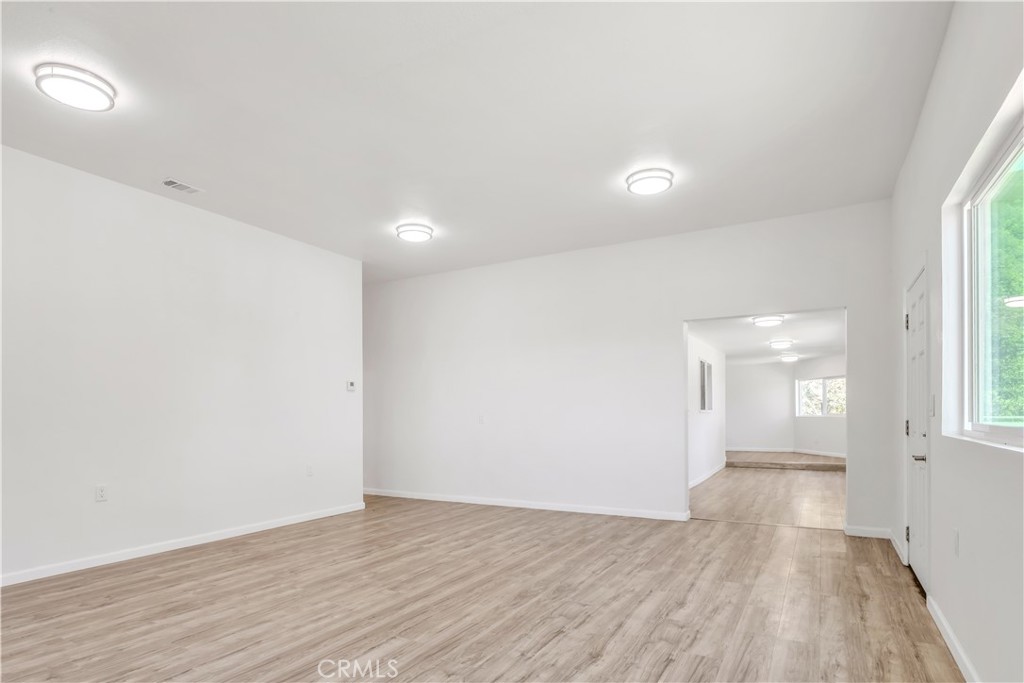 3273 Lee Street Nice, CA 95464 - Photo 21 of 50 wooden floor in an empty room with a window
