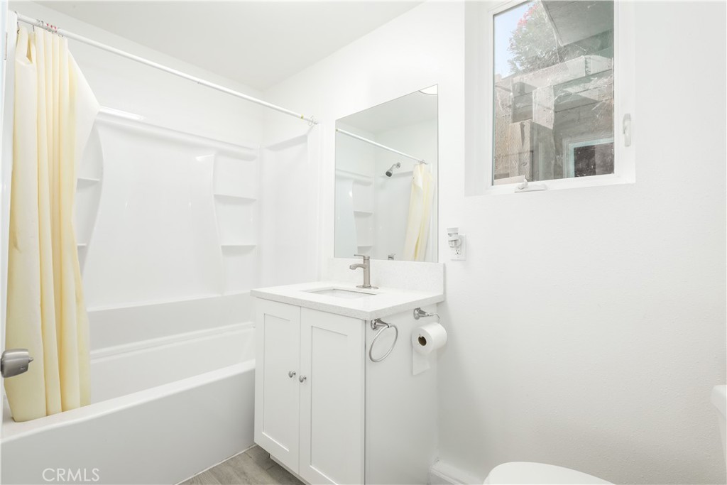 3273 Lee Street Nice, CA 95464 - Photo 46 of 50 a bathroom with a sink a toilet a mirror and shower