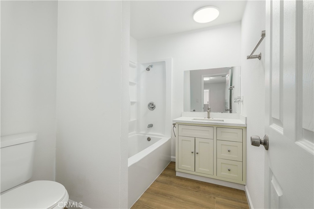 3273 Lee Street Nice, CA 95464 - Photo 47 of 50 a bathroom with a bathtub sink mirror vanity and toilet