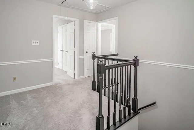 a view of a hallway with a door