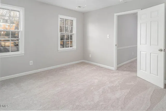 an empty room with windows