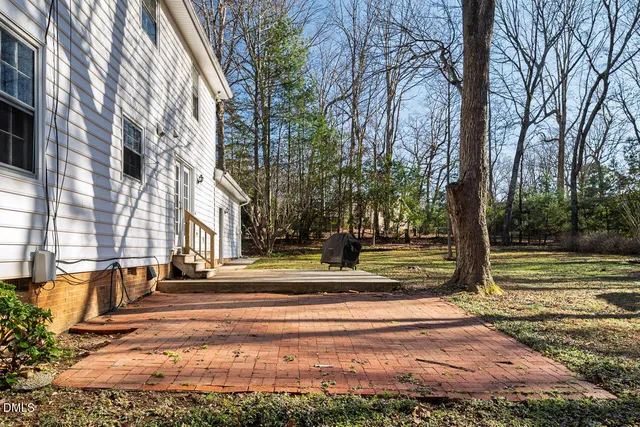 a view of park with large trees