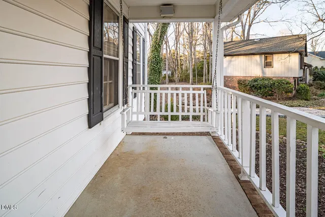 a view of a porch with wooden floor and outdoor space