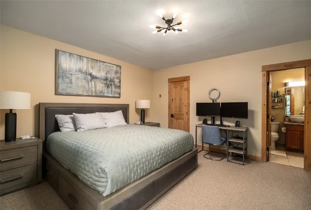 a bedroom with a bed and a view of bedroom