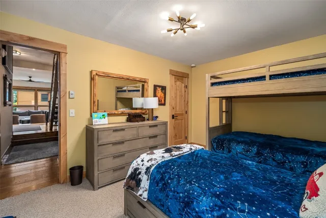 a bed room with a bed and dresser