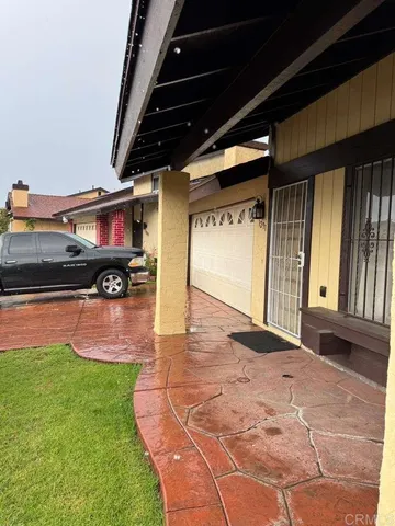 a swimming pool with yard in front of it
