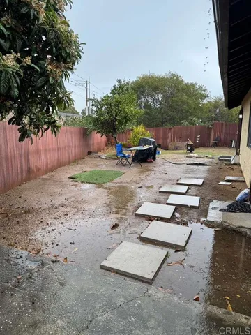 a view of a yard with furniture