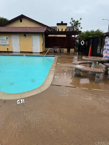 a view of a house with basketball court