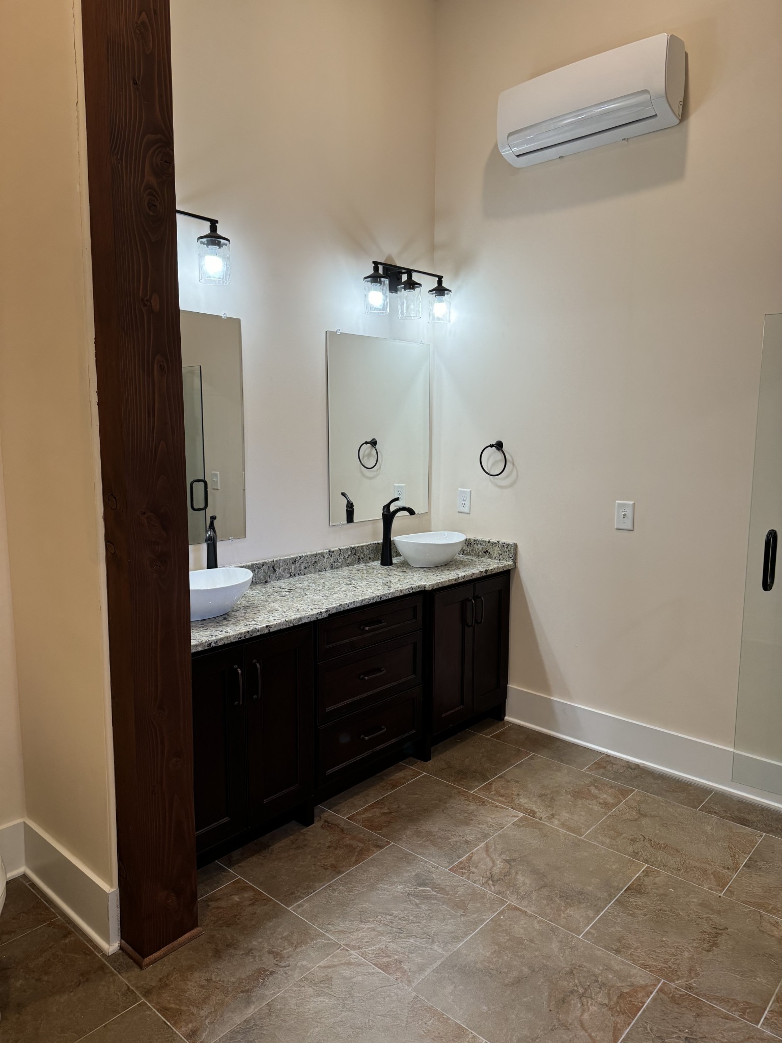 4451 Airport Road Springfield, TN 37172 - Photo 13 of 31 a bathroom with a double vanity sink and mirror