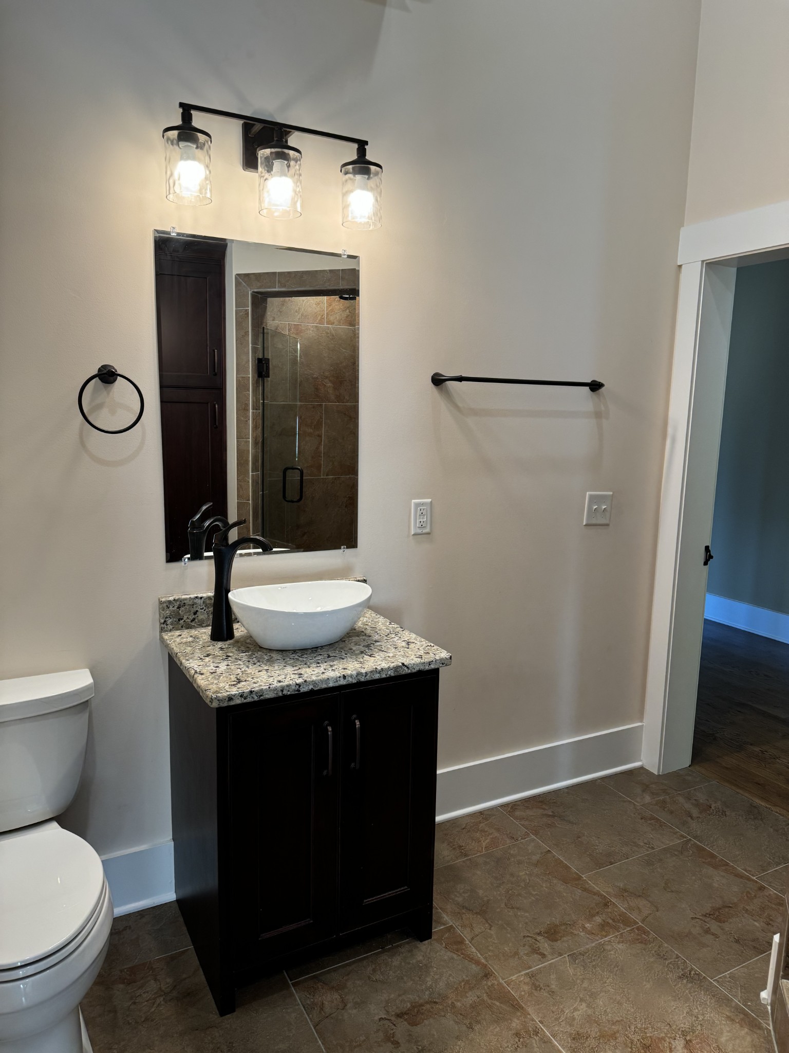 4451 Airport Road Springfield, TN 37172 - Photo 16 of 31 a bathroom with a granite countertop sink a toilet and mirror