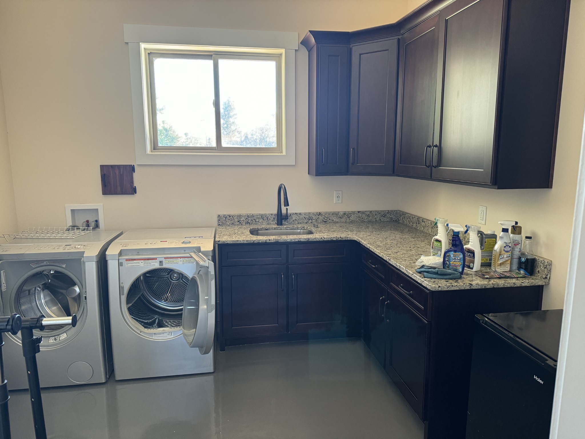 4451 Airport Road Springfield, TN 37172 - Photo 23 of 31 a kitchen with a sink and a washer dryer