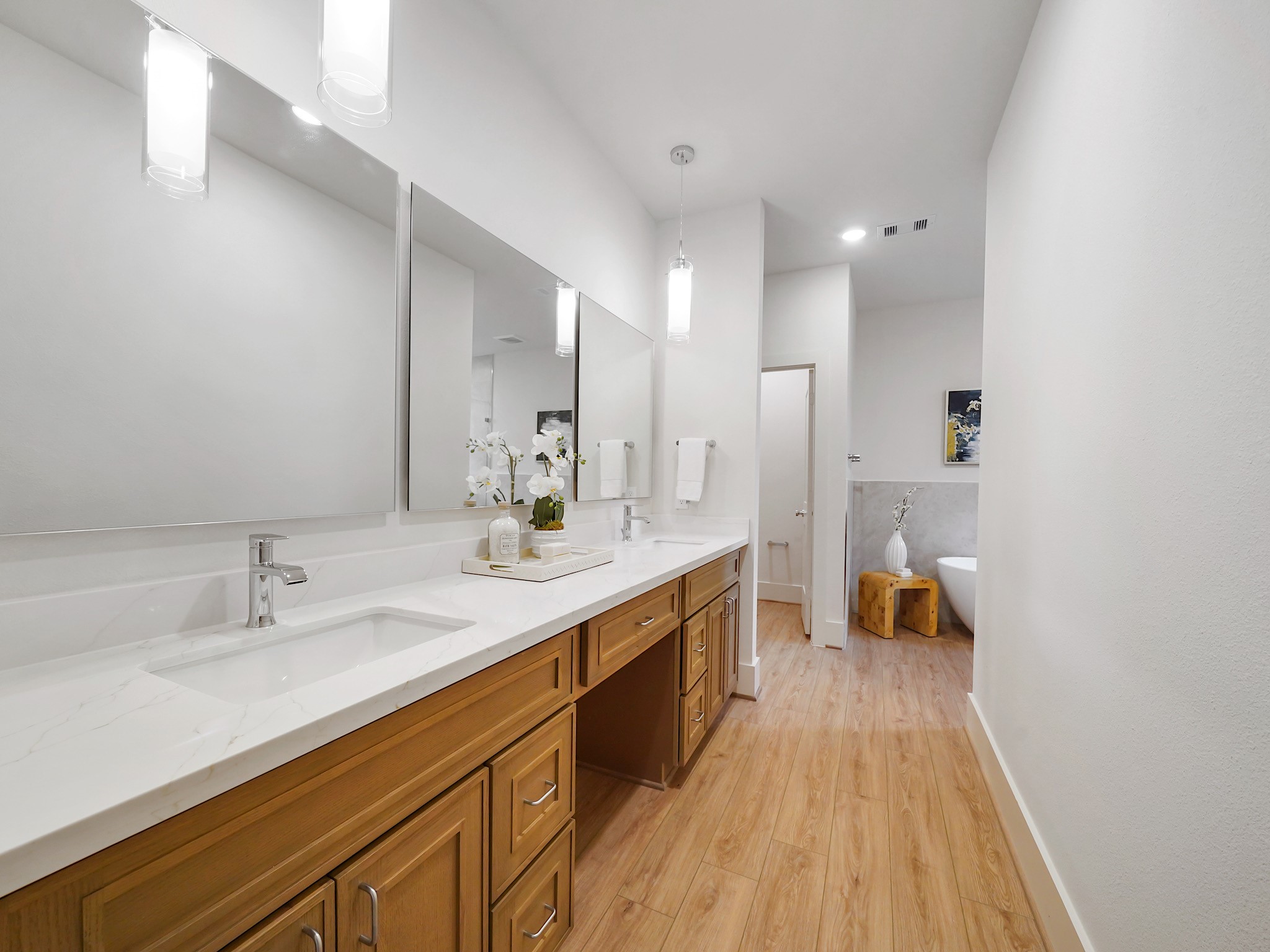 861 Rachel Street, Unit E Houston, TX 77091 - Photo 13 of 29 Experience the luxury of convenience in the primary bath with elegant double sinks and a spacious vanity.