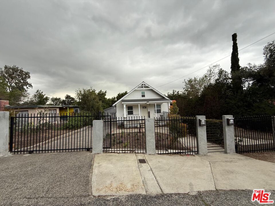 6520 Valmont Street Tujunga, CA 91042 - Photo 1 of 1 a view of a house with a wooden fence