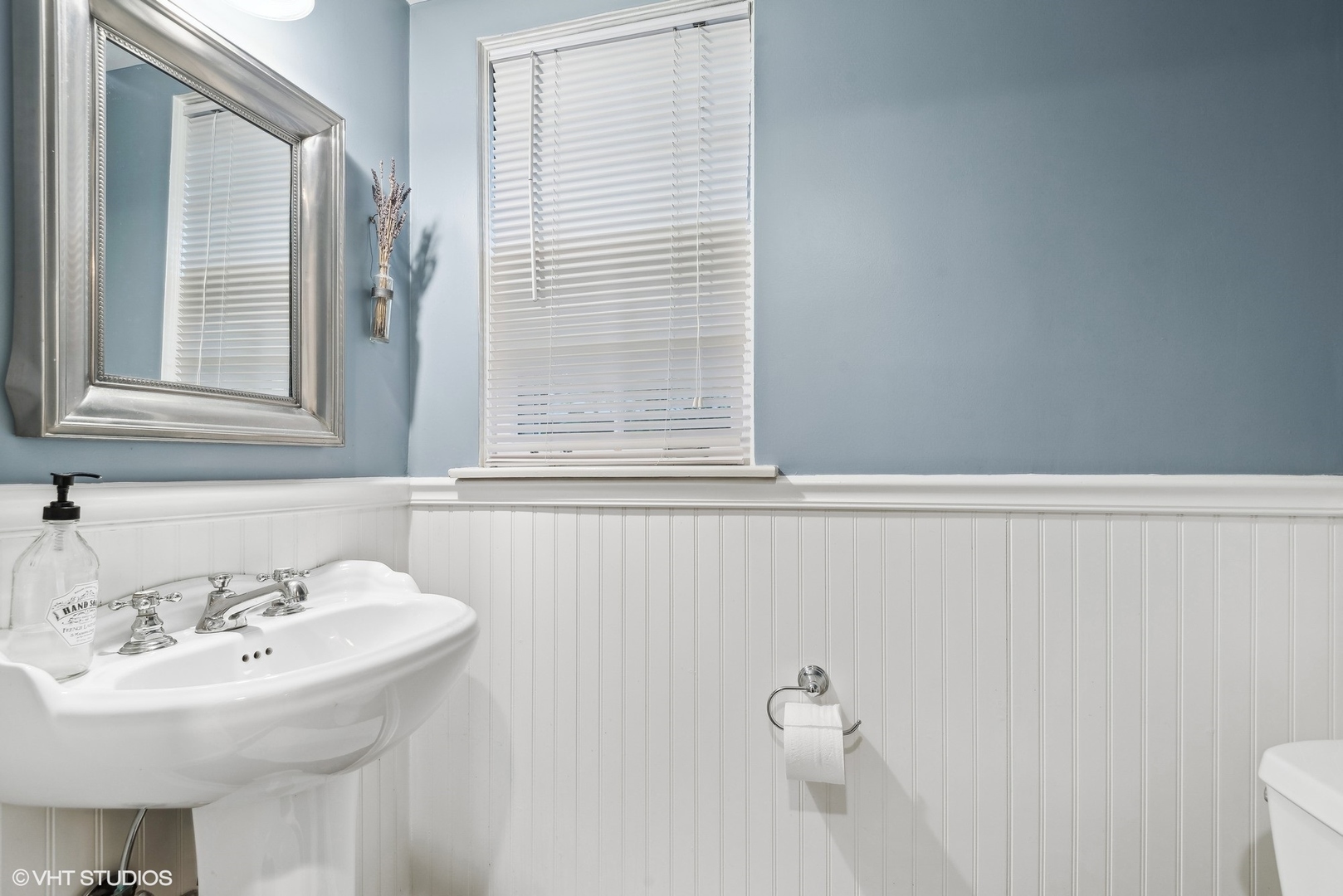 915 Pawnee Road Wilmette, IL 60091 - Photo 12 of 39 a bathroom with a sink and a toilet