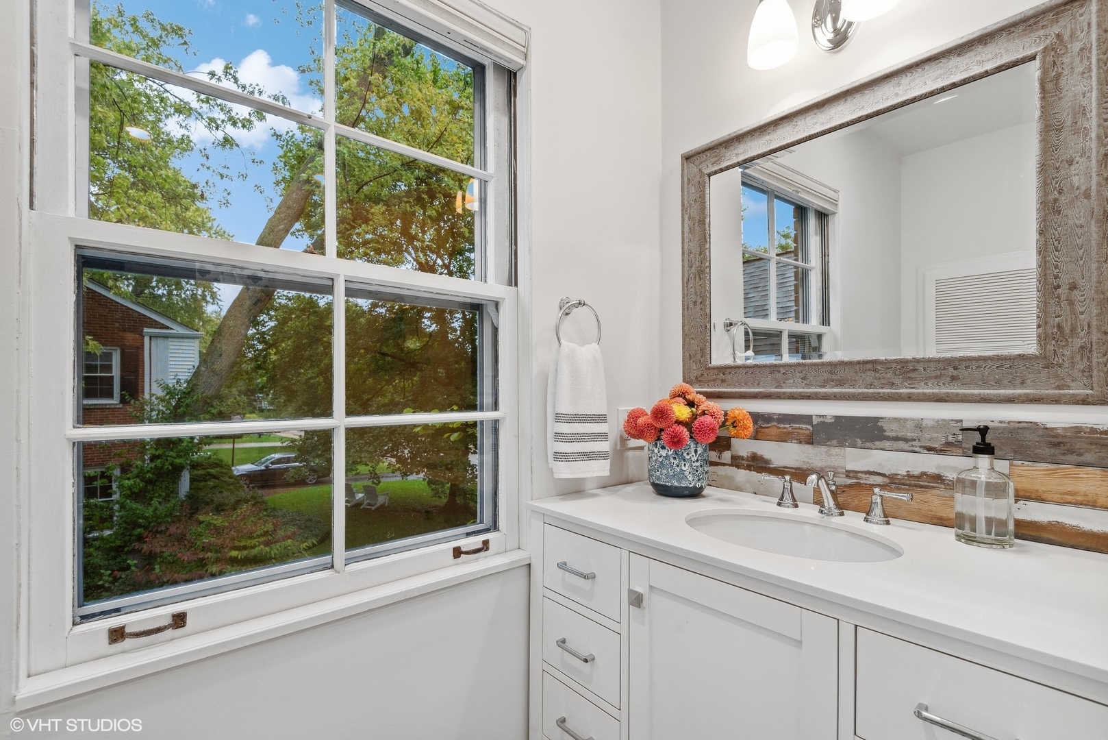 915 Pawnee Road Wilmette, IL 60091 - Photo 15 of 39 a bathroom sink with a mirror