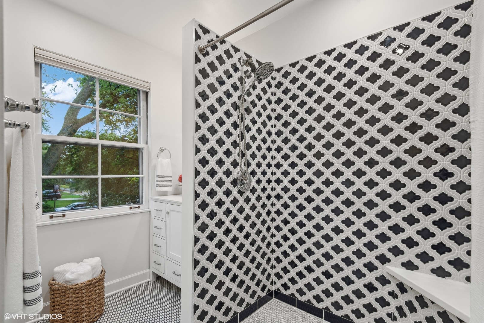 915 Pawnee Road Wilmette, IL 60091 - Photo 16 of 39 a bathroom with a black white checkered floor