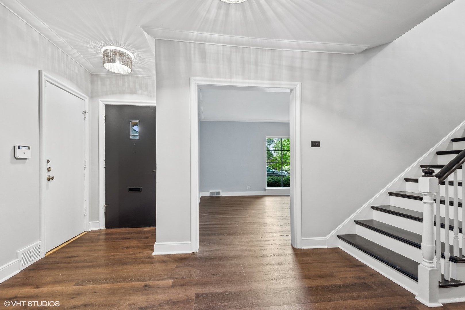 915 Pawnee Road Wilmette, IL 60091 - Photo 2 of 39 a view of entryway with wooden floor
