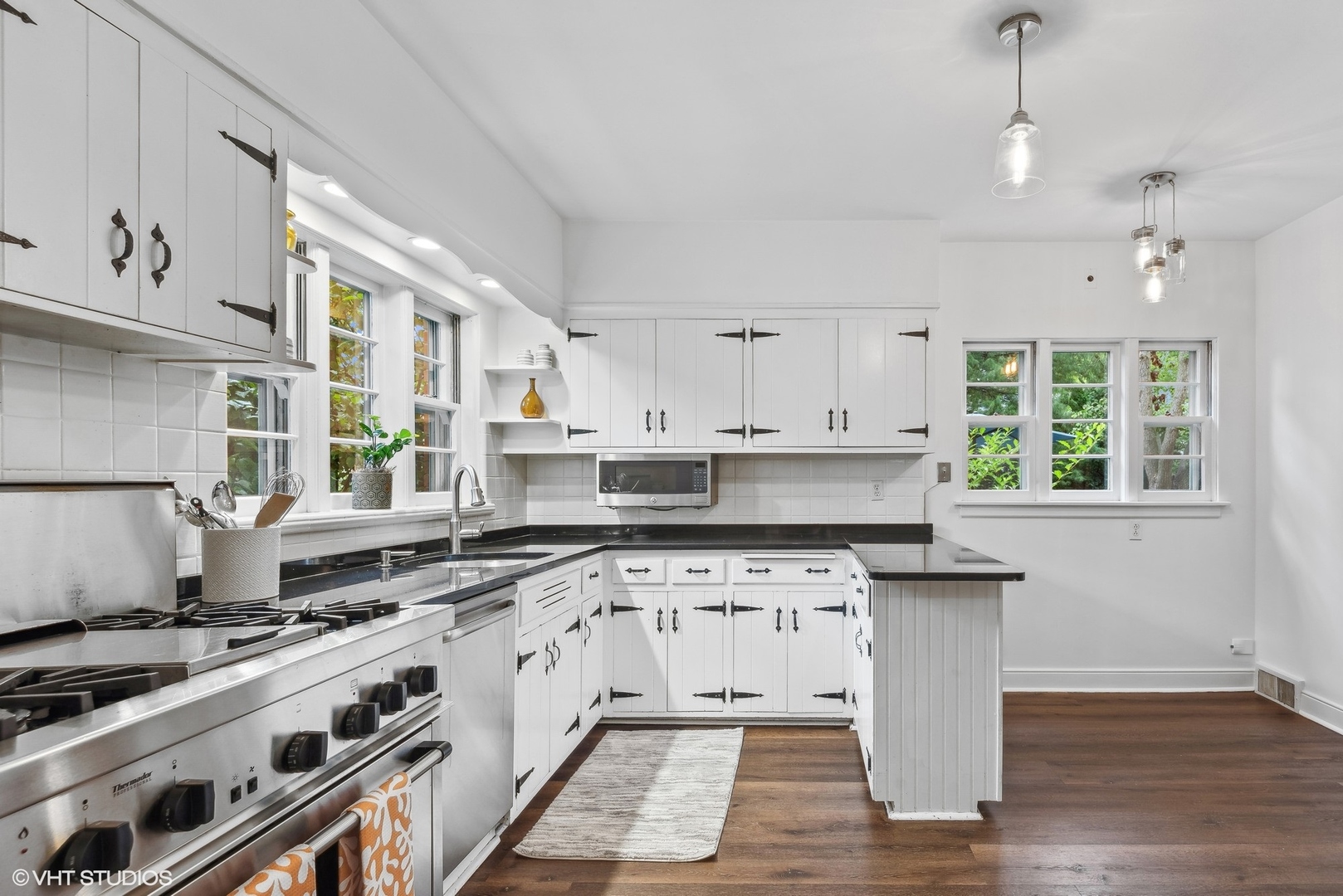 915 Pawnee Road Wilmette, IL 60091 - Photo 9 of 39 a kitchen with a stove a sink and a window