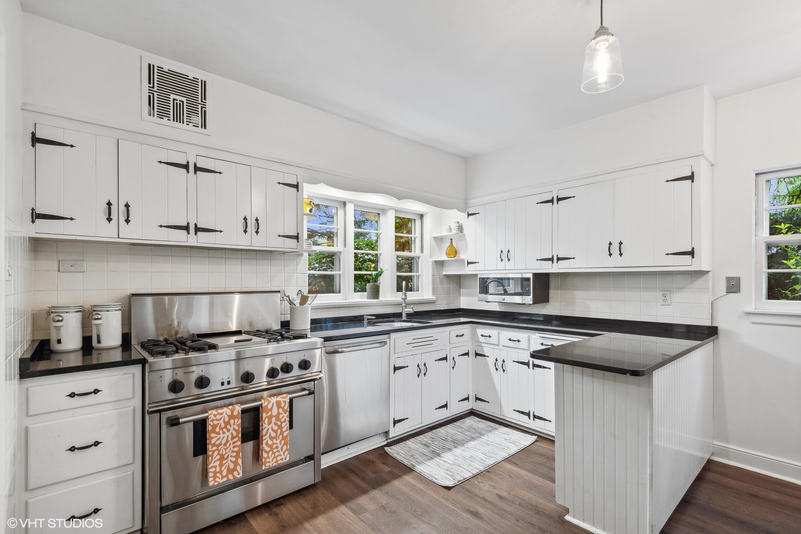915 Pawnee Road Wilmette, IL 60091 - Photo 10 of 39 a kitchen with stainless steel appliances granite countertop a stove a sink and white cabinets
