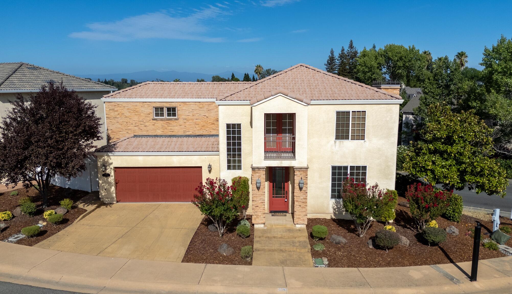 5592 Diamond Ridge Drive Redding, CA 96003 - Photo 4 of 45 a front view of a house with a yard