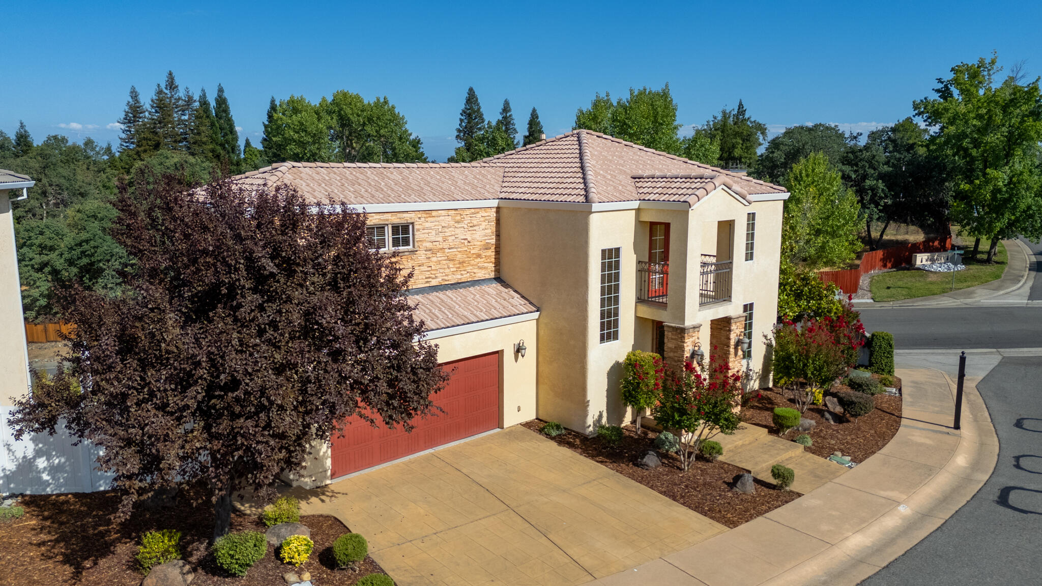 5592 Diamond Ridge Drive Redding, CA 96003 - Photo 44 of 45 a view of a white house with a small yard and potted plants