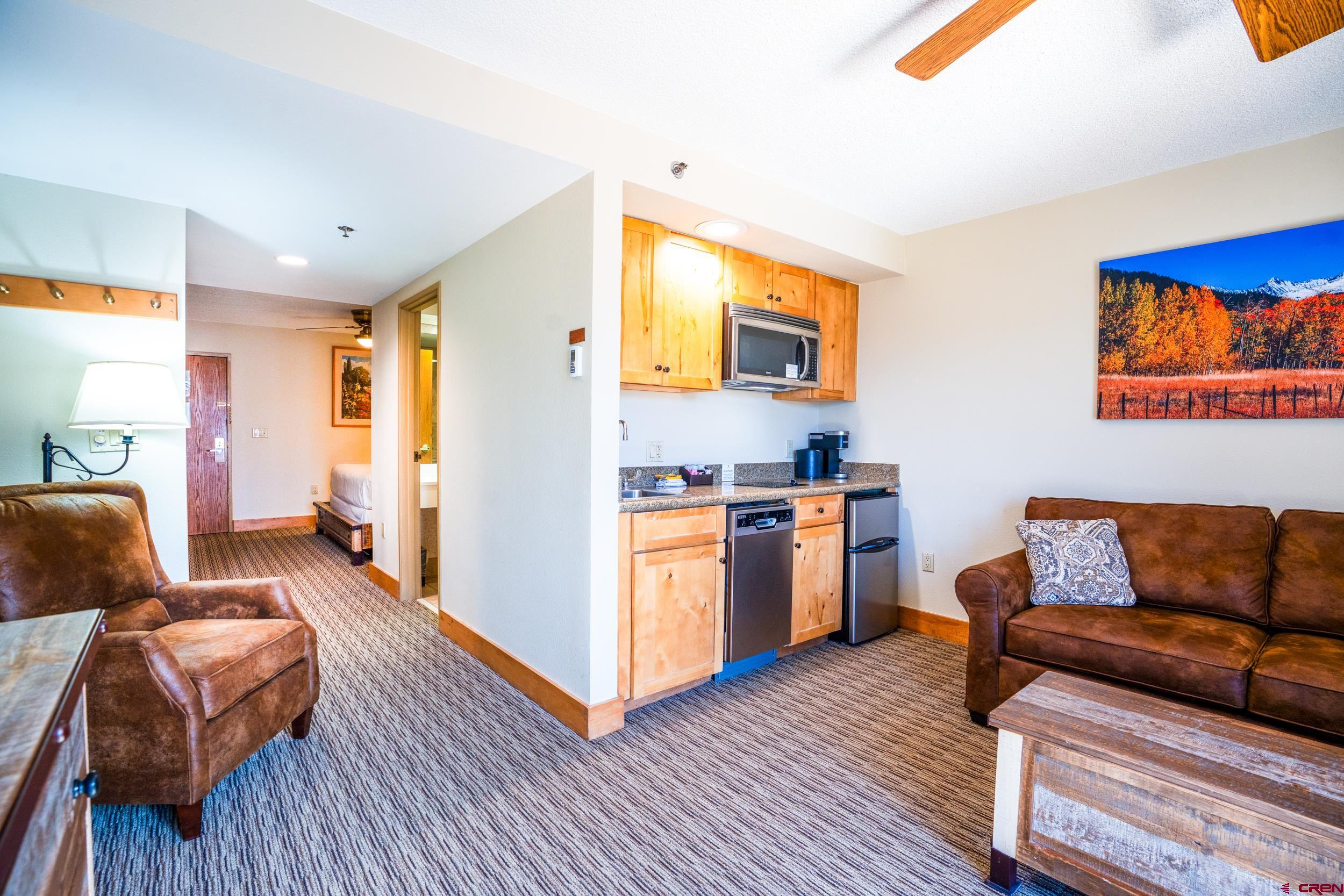 6 Emmons Road, Unit 463 Crested Butte, CO 81225 - Photo 4 of 21 a living room with furniture and a wooden floor