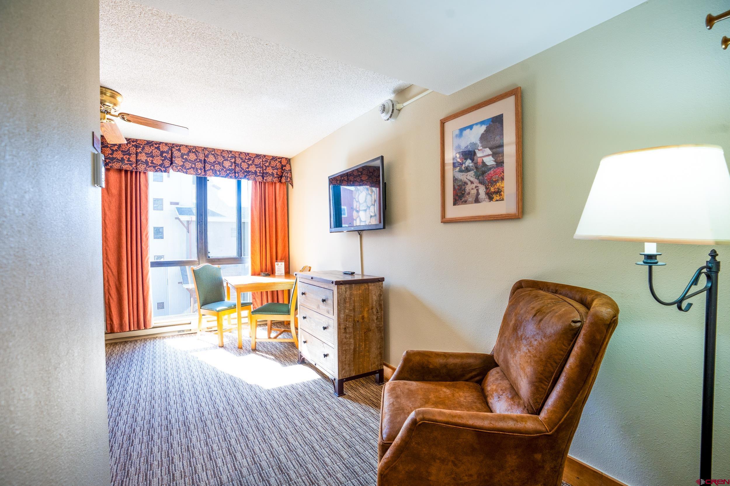 6 Emmons Road, Unit 463 Crested Butte, CO 81225 - Photo 6 of 21 a living room with furniture and a window