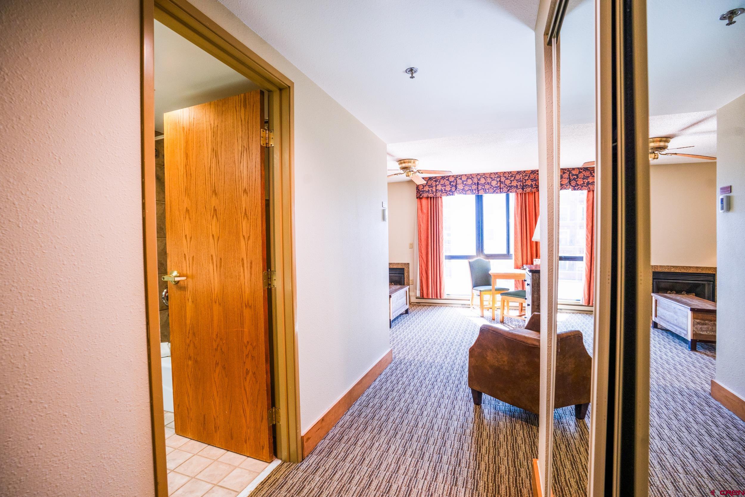 6 Emmons Road, Unit 463 Crested Butte, CO 81225 - Photo 9 of 21 a view of a bedroom with wooden floor