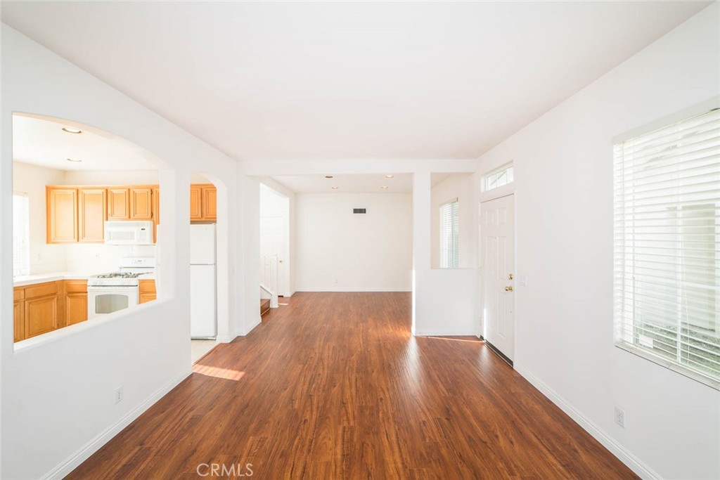 124 Cherrybrook Lane Irvine, CA 92618 - Photo 2 of 28 a view of a big room with wooden floor and windows