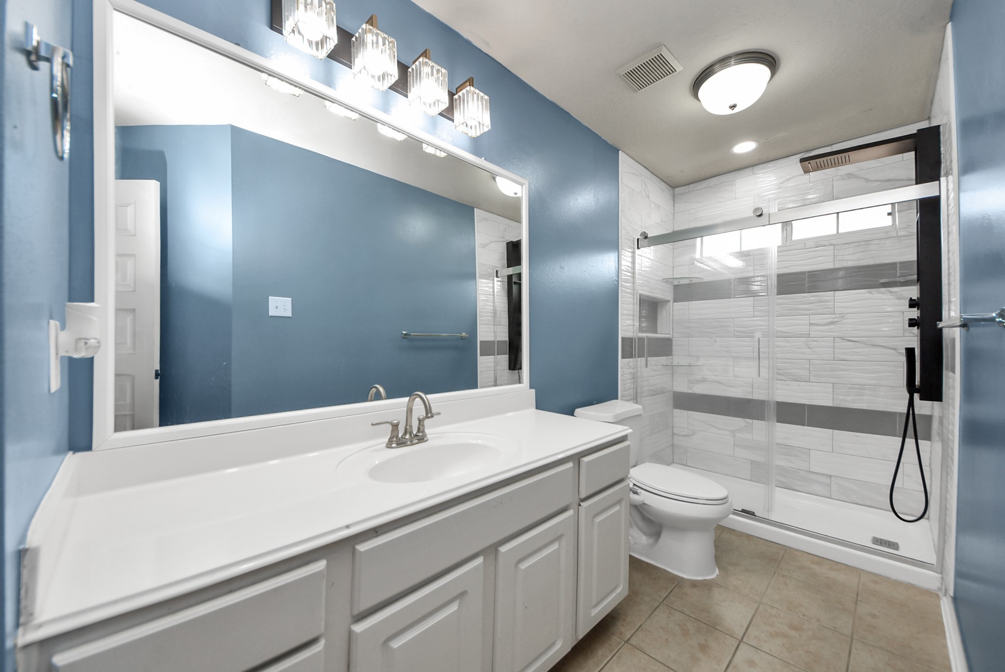 14103 Imperial Wood Lane Rosharon, TX 77583 - Photo 29 of 36 Renovated secondary bathroom with spa-inspired walk-in shower