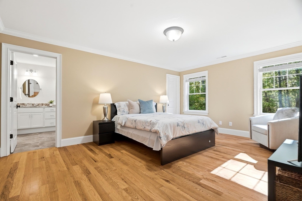 6 Flintlock Road Lexington, MA 02420 - Photo 24 of 39 a bedroom with a bed and a couch