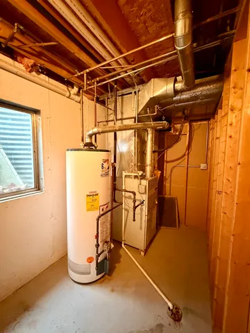 a view of a room with water heater and storage
