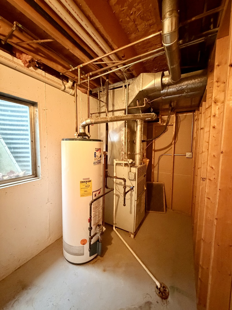 19301 Enclave Lane Tinley Park, IL 60487 - Photo 18 of 18 a view of a room with water heater and storage