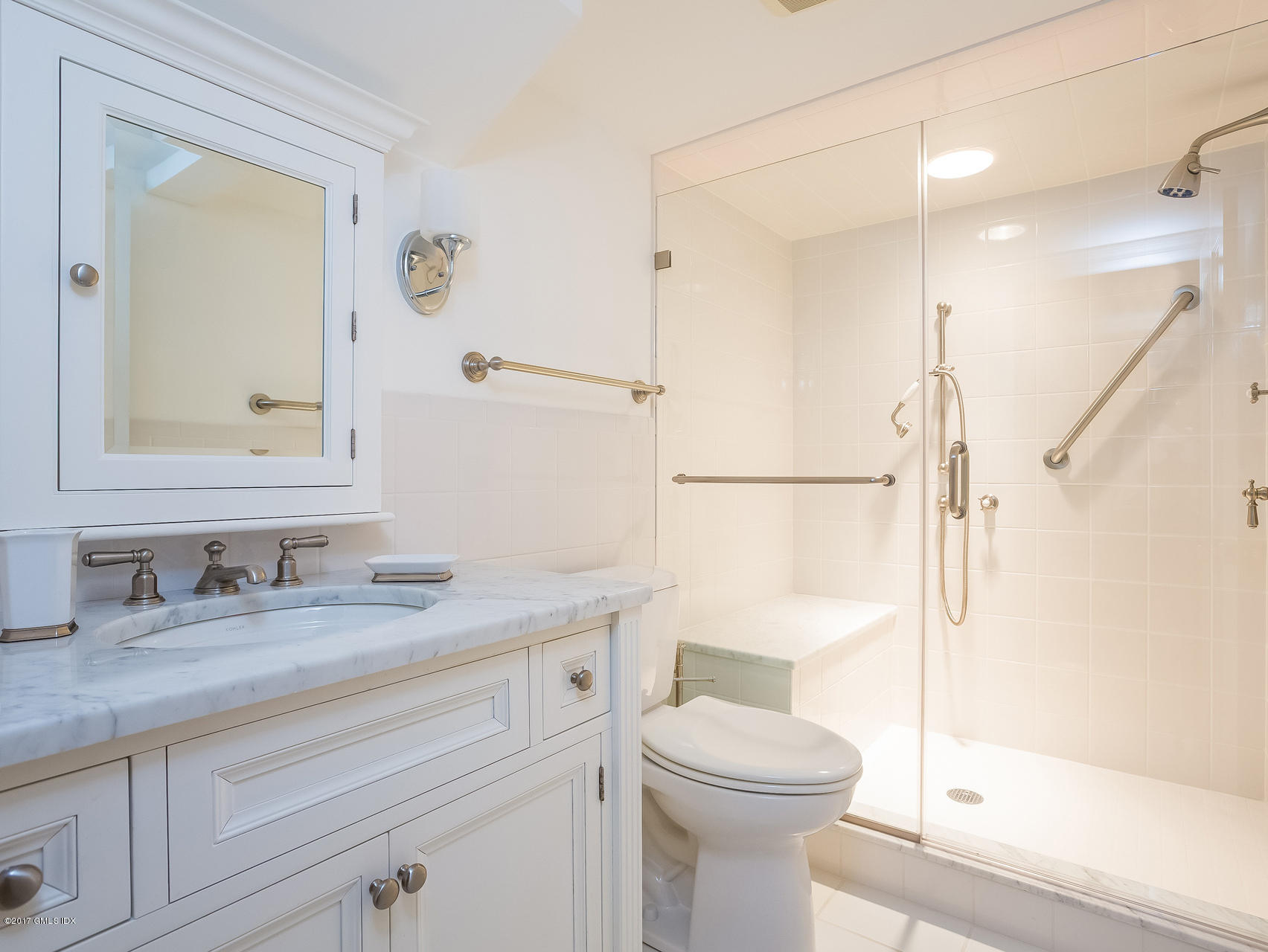 1 Elizabeth Lane Riverside, CT 06878 - Photo 19 of 26 a bathroom with a granite countertop sink toilet mirror and shower