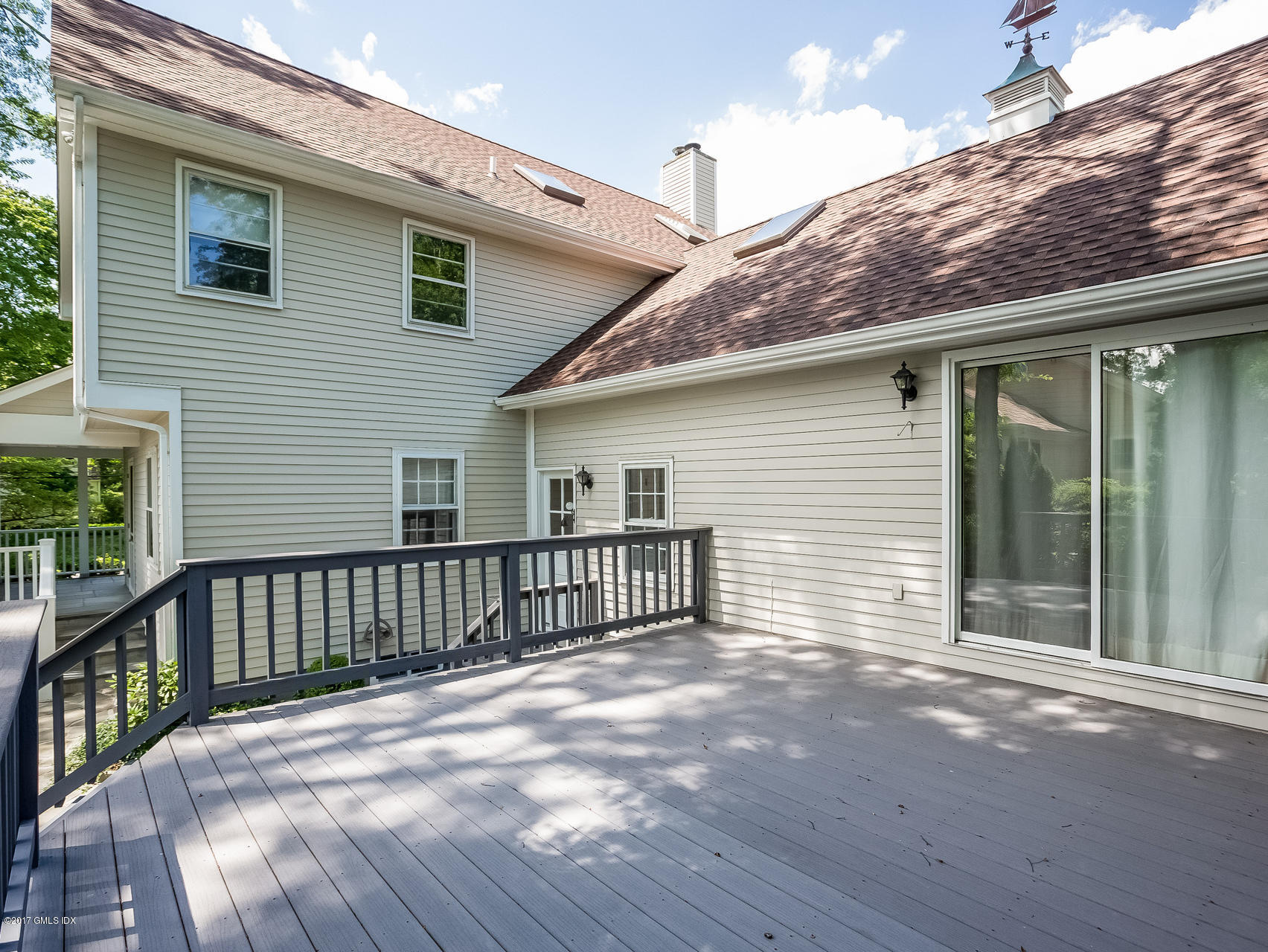 1 Elizabeth Lane Riverside, CT 06878 - Photo 20 of 26 a view of a house with wooden deck