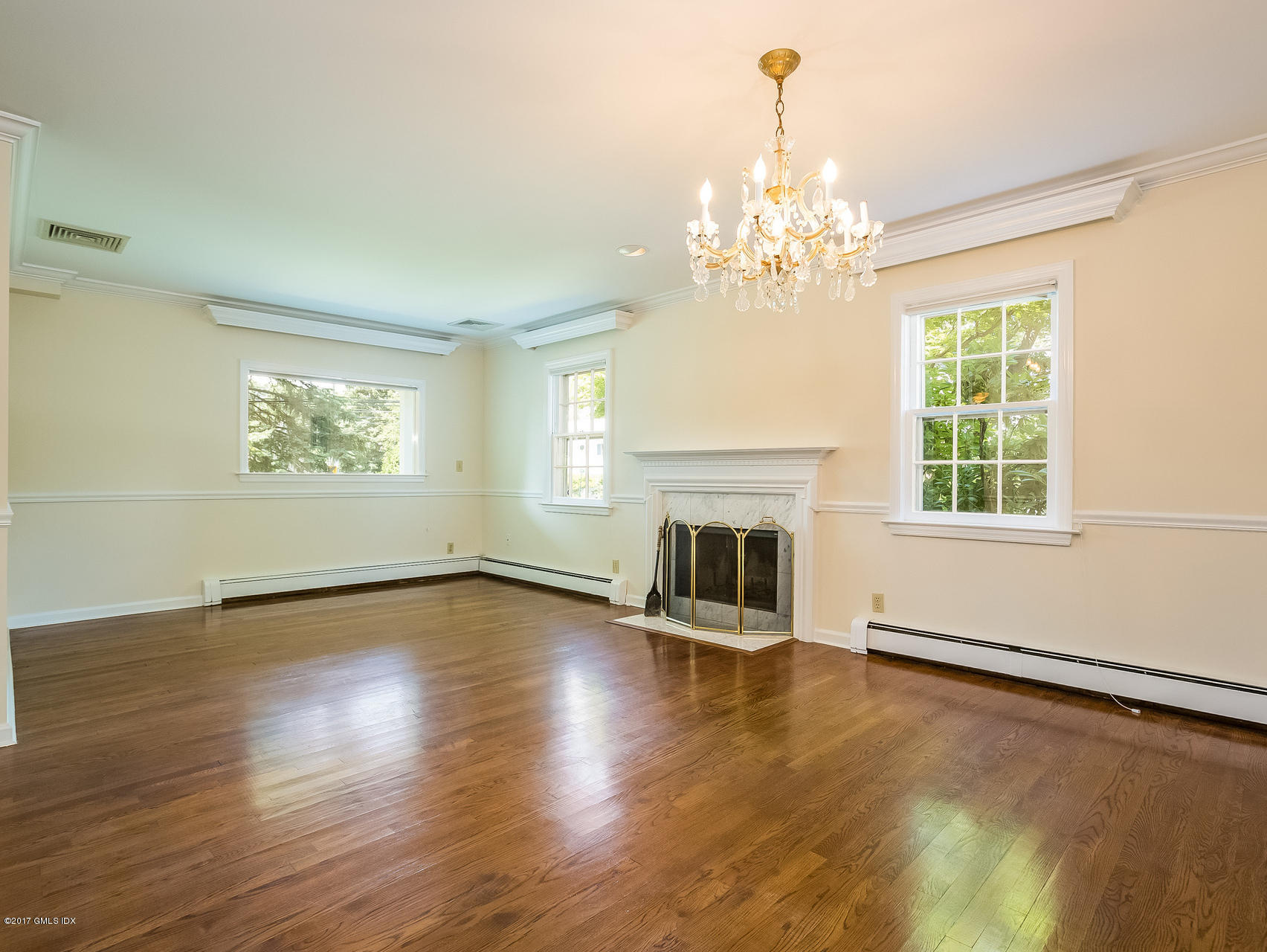 1 Elizabeth Lane Riverside, CT 06878 - Photo 3 of 26 a view of an empty room with window and wooden floor