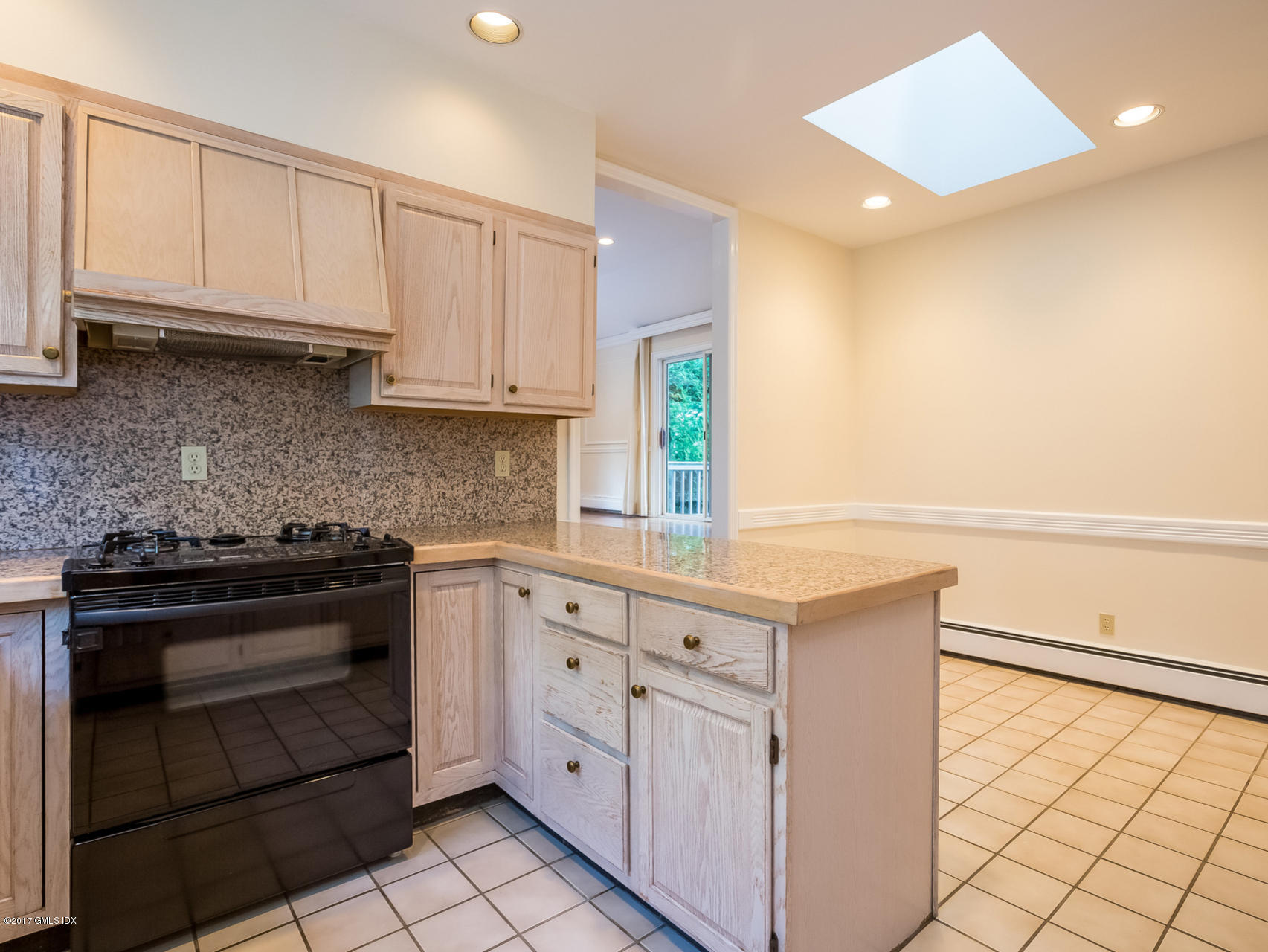 1 Elizabeth Lane Riverside, CT 06878 - Photo 5 of 26 a kitchen with granite countertop white cabinets and white appliances