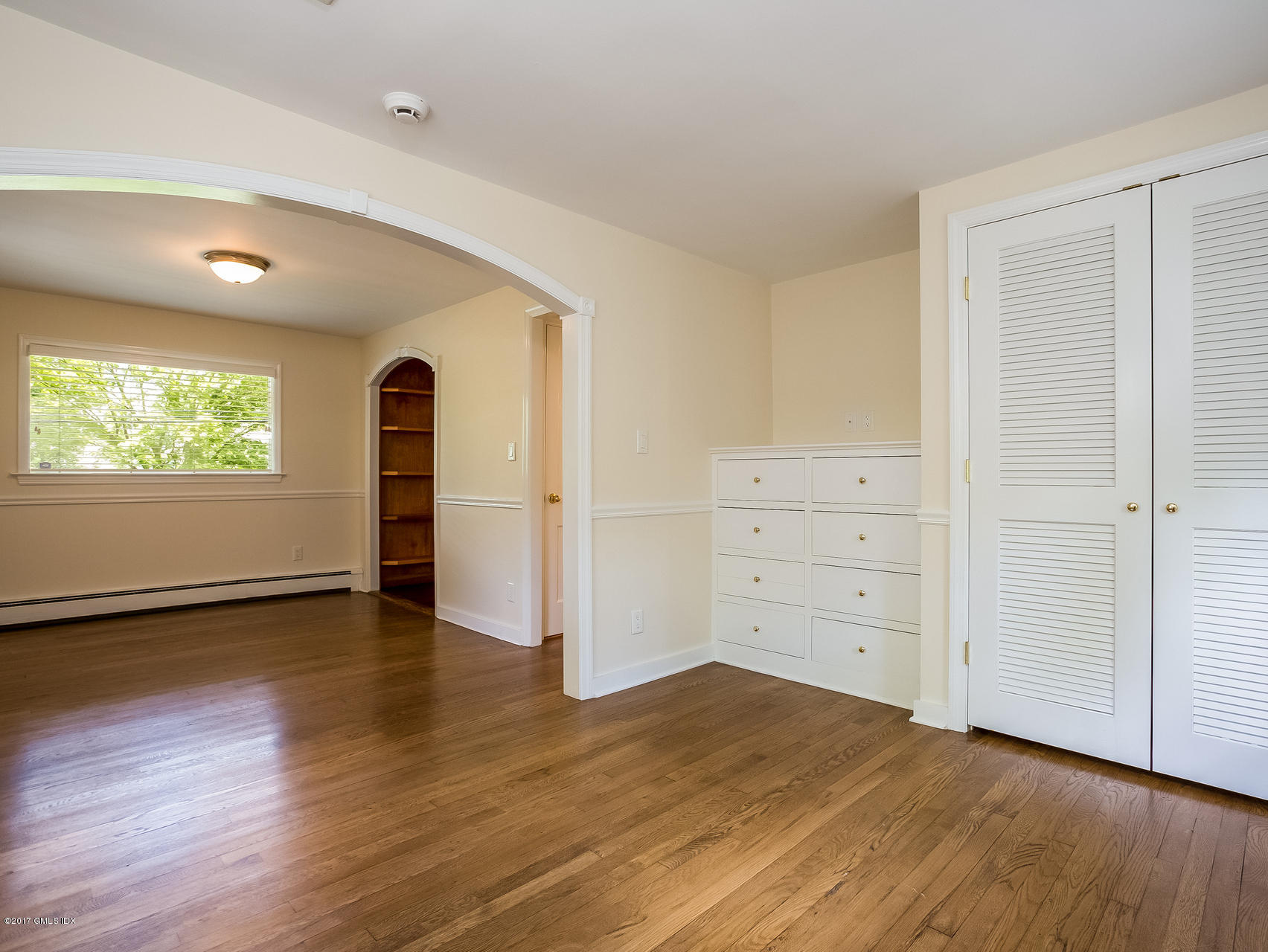 1 Elizabeth Lane Riverside, CT 06878 - Photo 9 of 26 an empty room with wooden floor closet and windows