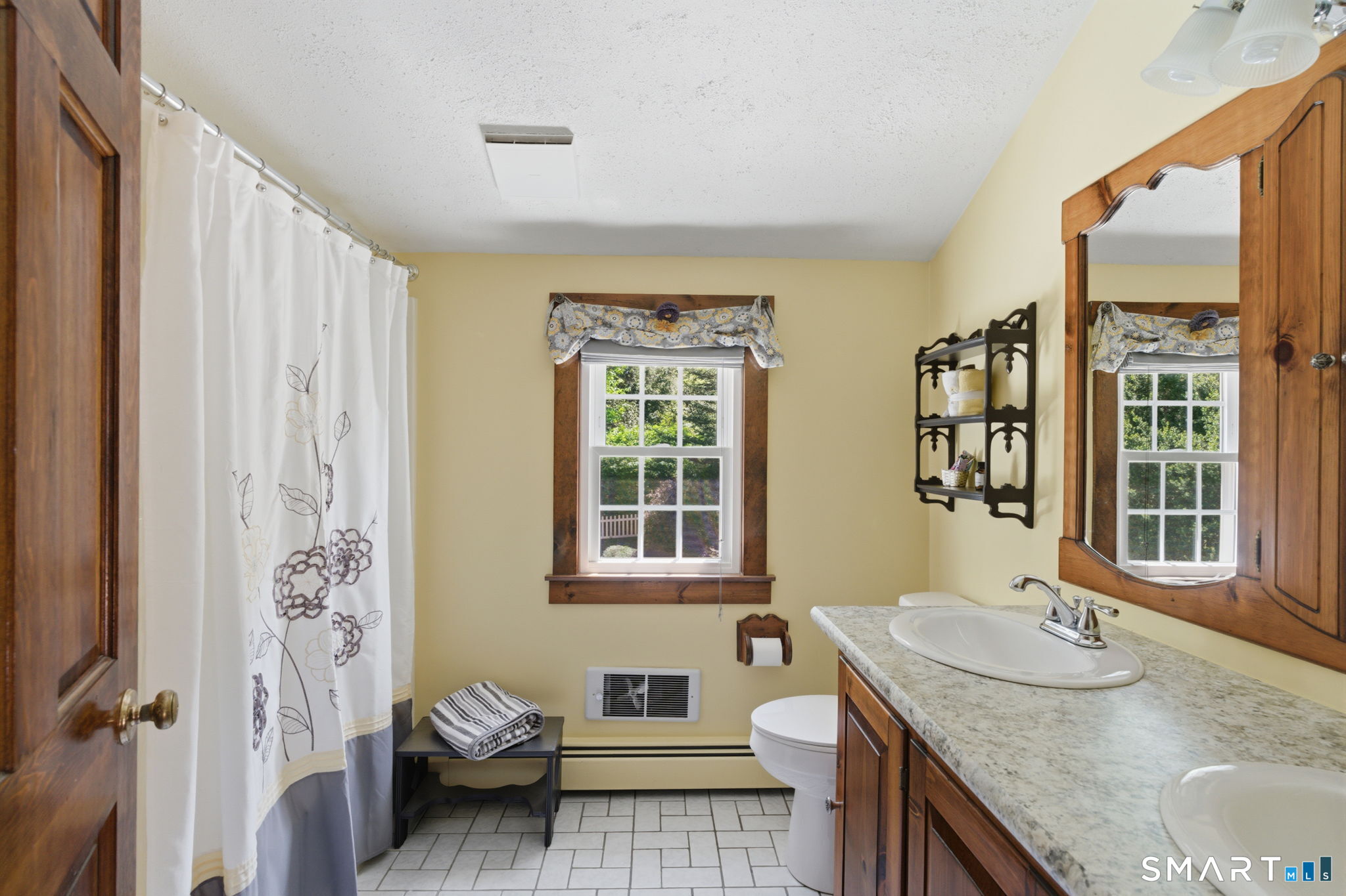 79 Buckboard Lane Bristol, CT 06010 - Photo 35 of 40 a bathroom with a granite countertop sink and a mirror