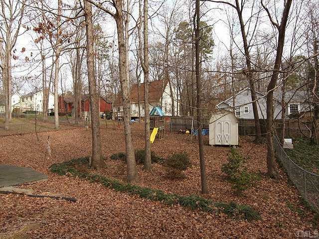 7308 Mill Ridge Road Raleigh, NC 27613 - Photo 10 of 11 Fenced in Yard with Playset and Storage Shed