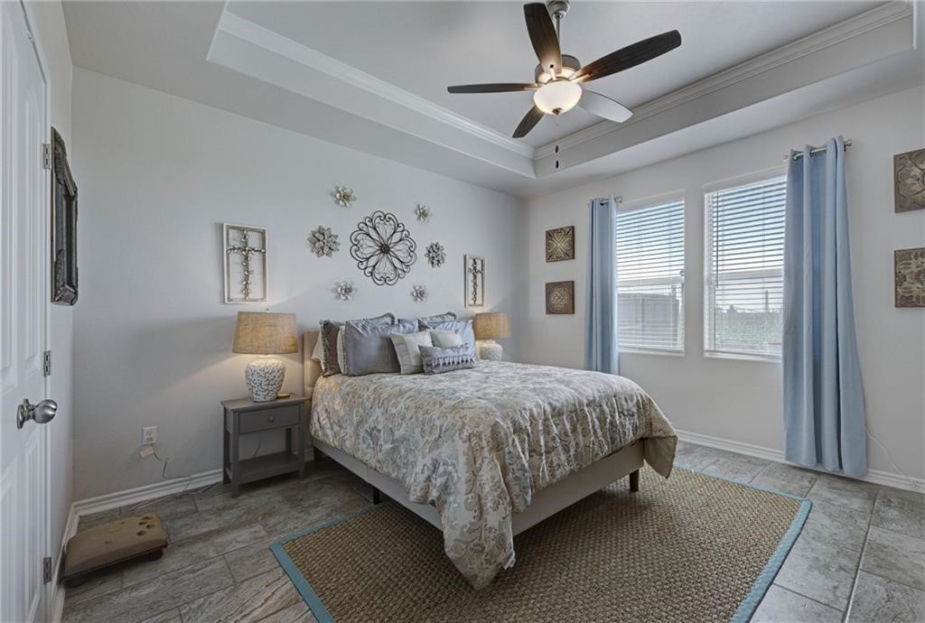 1007 Ocean Breeze Portland, TX 78374 - Photo 14 of 17 a bedroom with a bed and a window