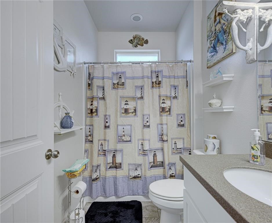 1007 Ocean Breeze Portland, TX 78374 - Photo 15 of 17 a bathroom with a sink toilet and shower