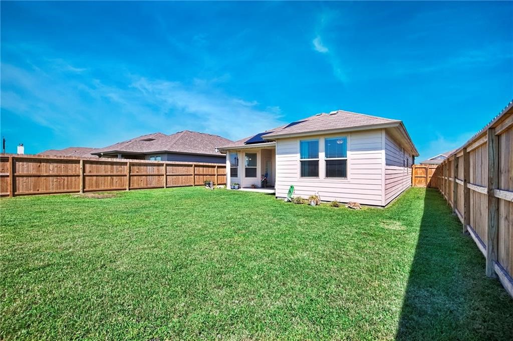 1007 Ocean Breeze Portland, TX 78374 - Photo 17 of 17 a front view of a house with garden