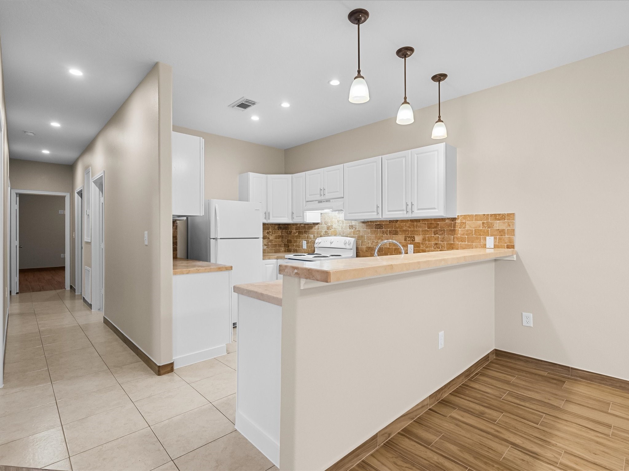 533 12th Street San Leon, TX 77539 - Photo 11 of 29 a room with stainless steel appliances granite countertop a refrigerator and a stove top oven