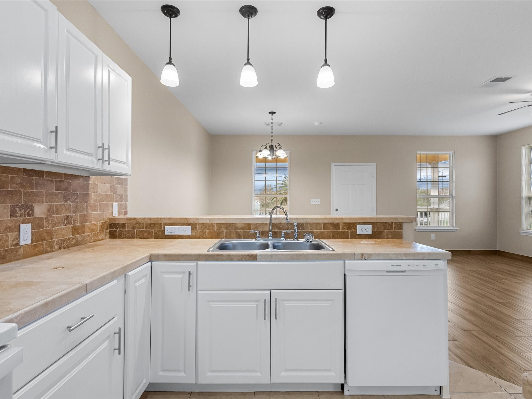 533 12th Street San Leon, TX 77539 - Photo 12 of 29 a kitchen that has a sink and cabinets in it