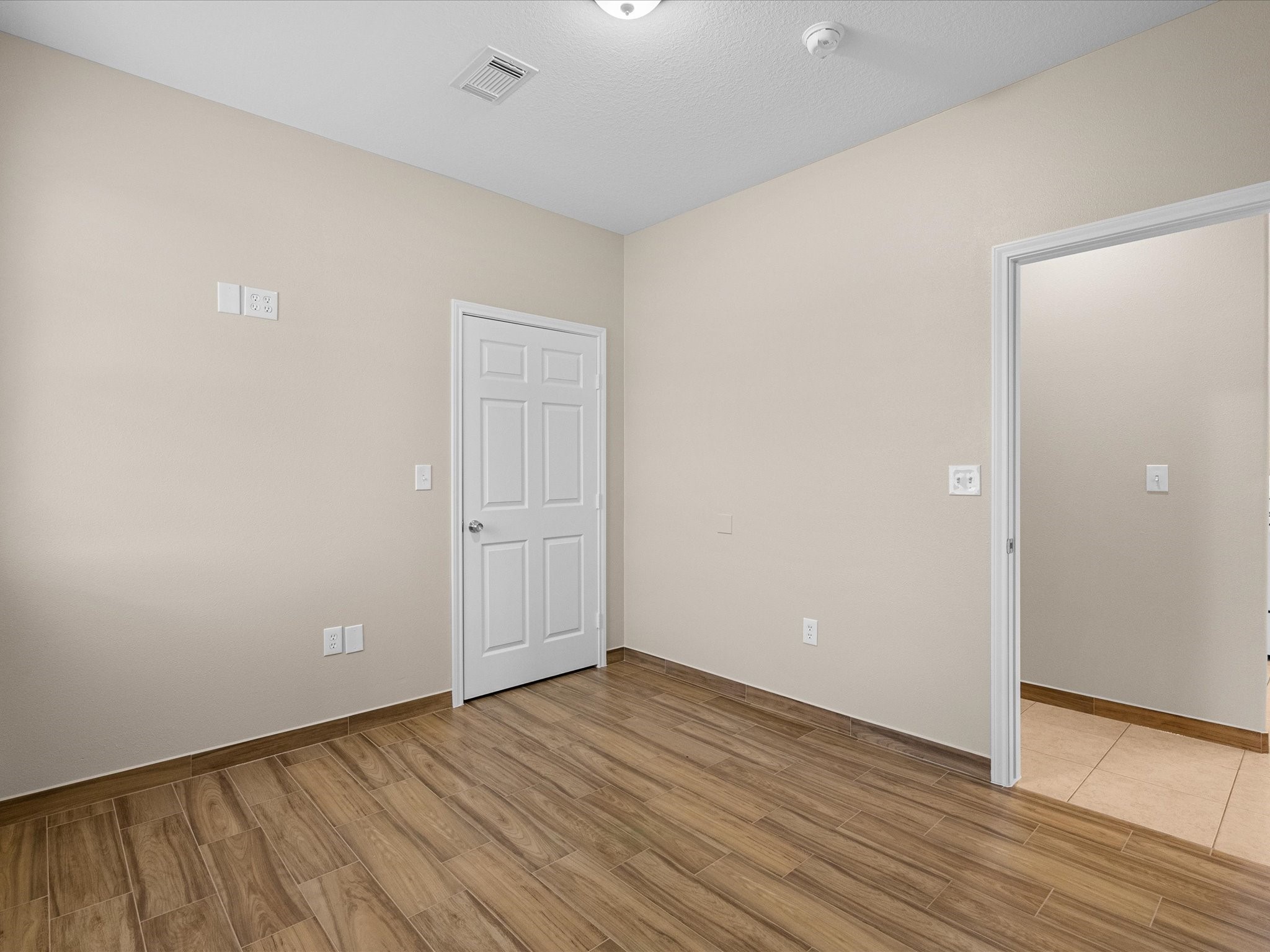 533 12th Street San Leon, TX 77539 - Photo 18 of 29 a view of an empty room with wooden floor and closet